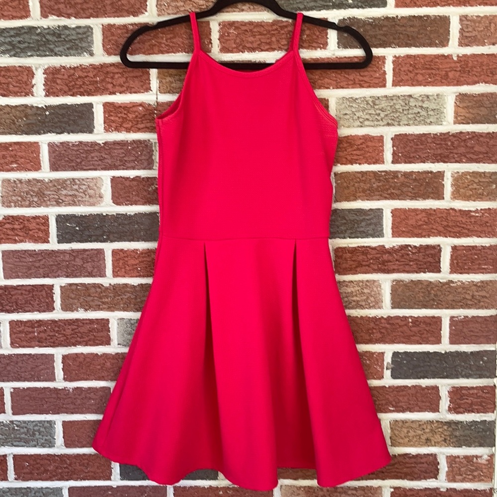 Like New- Red spaghetti strap dress. Size is a juniors medium.